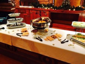 Spread of appetizers on display at a catered holiday party